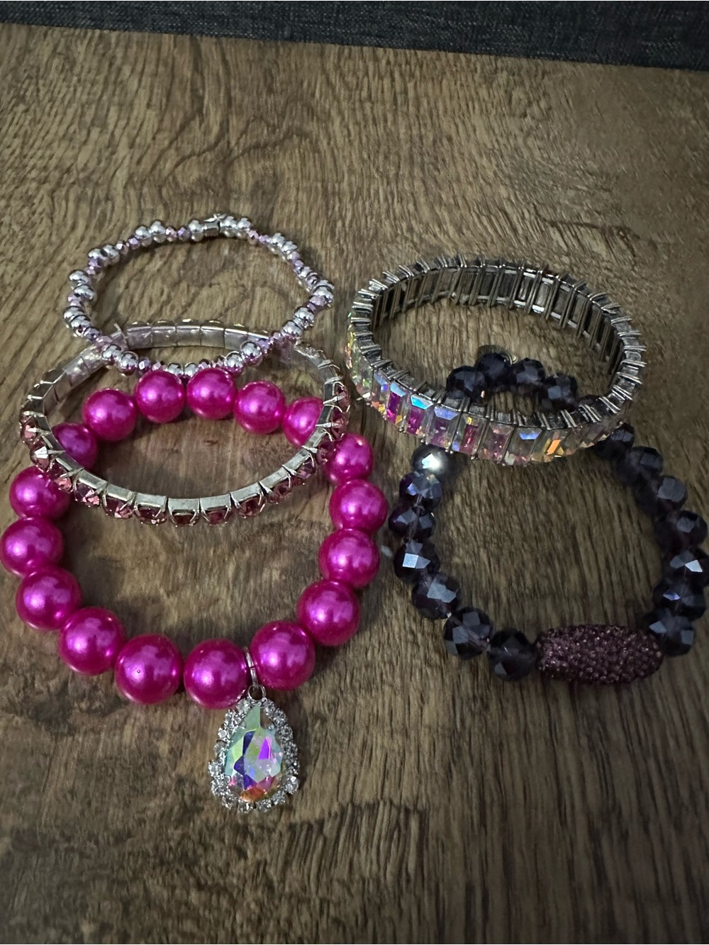 5 stretchy pink/silver bracelets. Excellent condition.